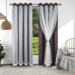 Modern window with Layered blackout curtains and sheer white voile