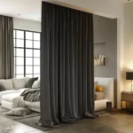 ceiling-mounted living room blackout curtains as a stylish room divider between the sleeping area and lounge.