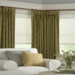 layered living room blackout curtains in olive green with a geometric print, styled with white blinds