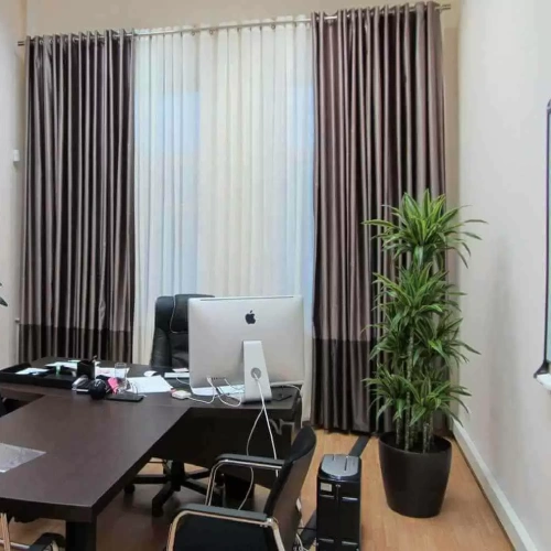 Eyelet home office curtains in a sleek, two-tone chocolate brown and beige satin fabric.