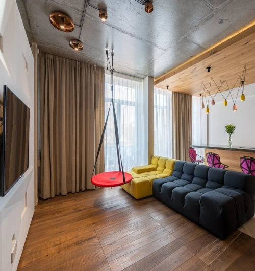 beige home theater blackout curtains paired with sheer white liners for versatile light control