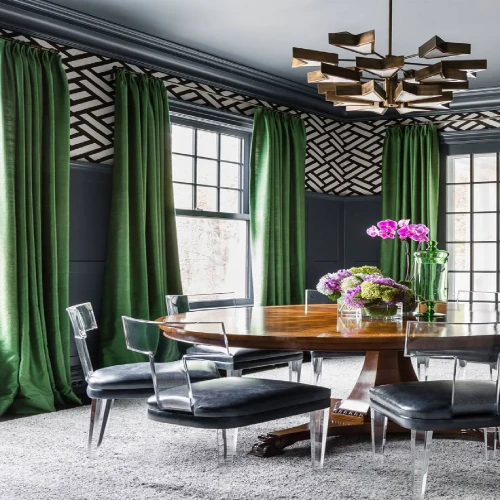 dark navy blue walls with geometric pattern wallpaper on the upper section and floor-to-ceiling dining area blackout curtains in a rich emerald green velvet fabric